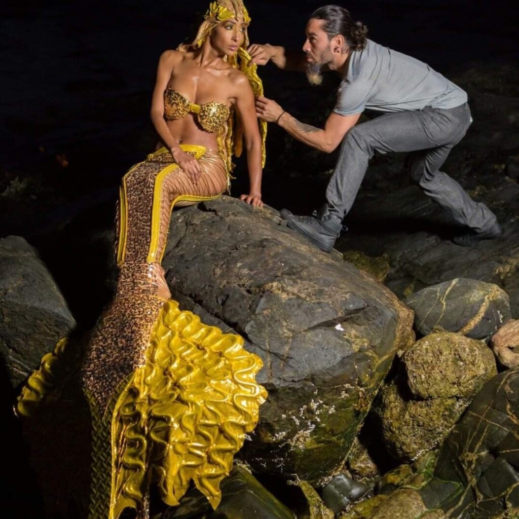 Model Wearing a Mermaid Costume Assisted by Hair Stylist